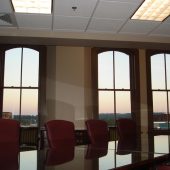 conference room with large windows at dusk