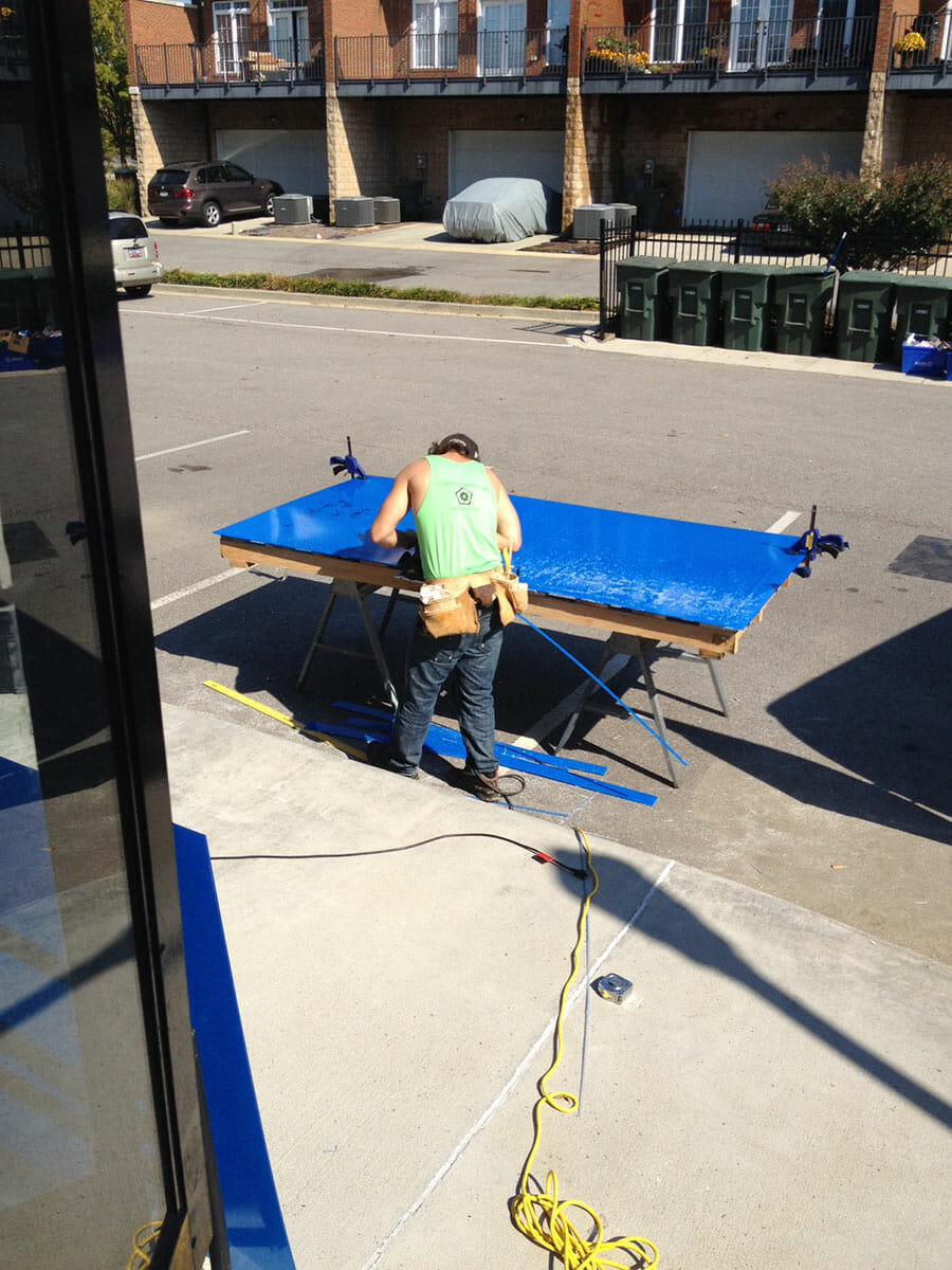 technician crafting custom climate seal residential acoustic inserts