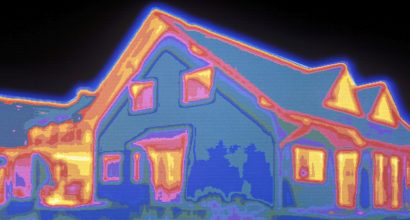 Thermographic view of a house showing heat loss from windows