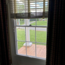Living room window features an Acoustic Surfaces Inc. Climate Seal window insert